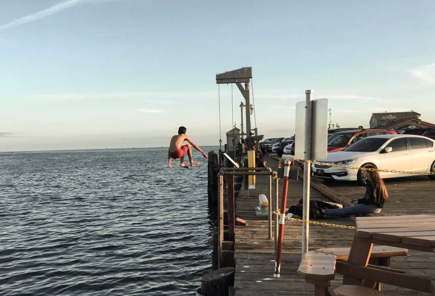 Josh jumping off the pier